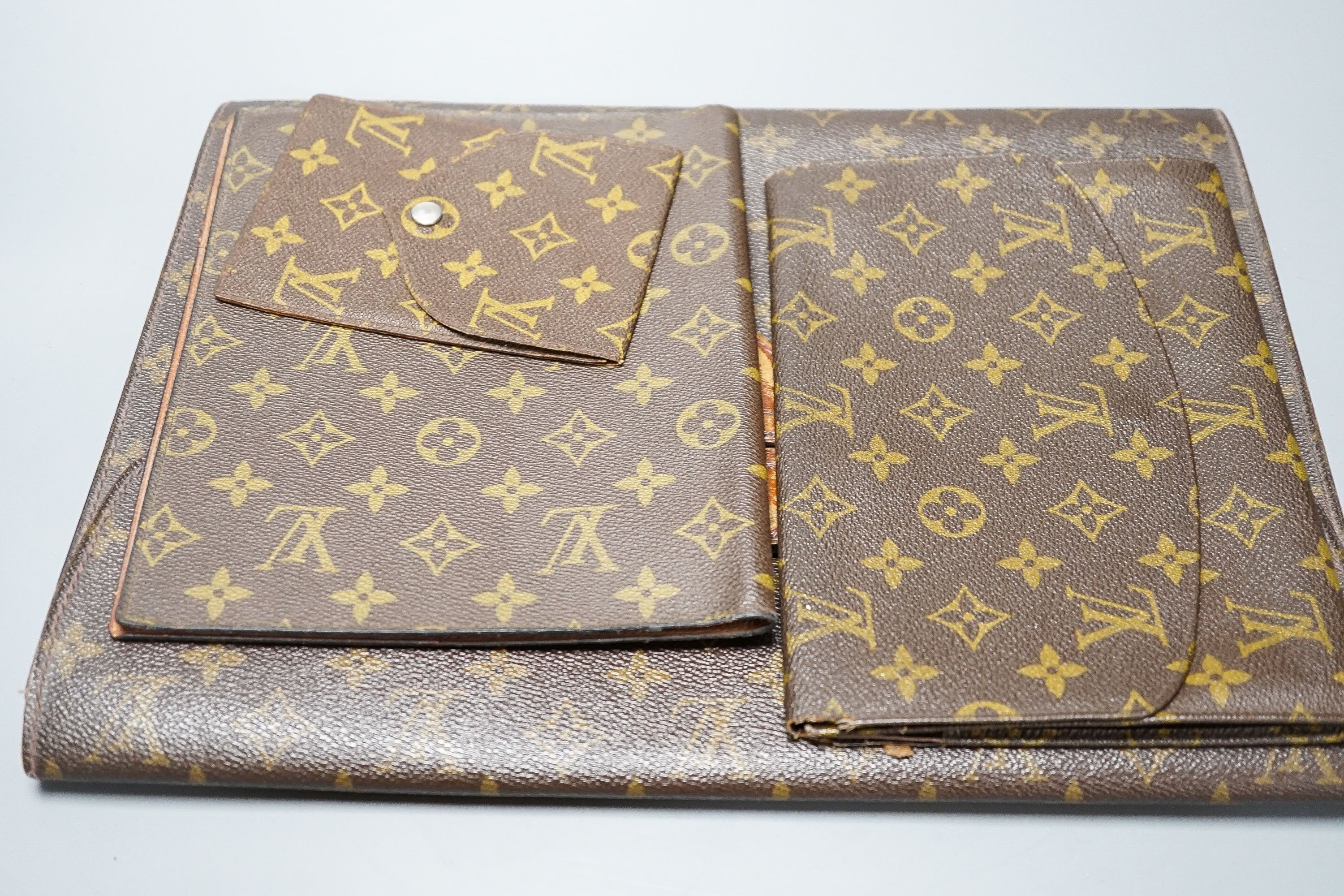 Five Pieces of Louis Vuitton to including a toilet bag, and two soft cases.